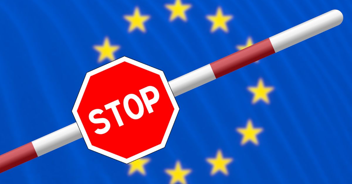 An illustration of a red stop barrier against the backdrop of the European Union flag with yellow stars.