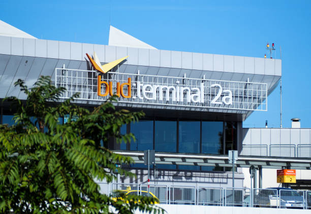 Photo of Budapest Airport Terminal 2A building with the terminal logo displayed on the exterior under a clear blue sky.
