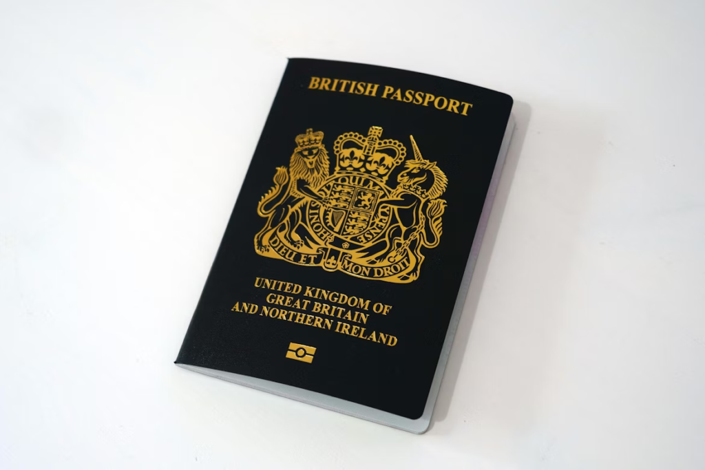 British passport with gold crest placed on a white background.