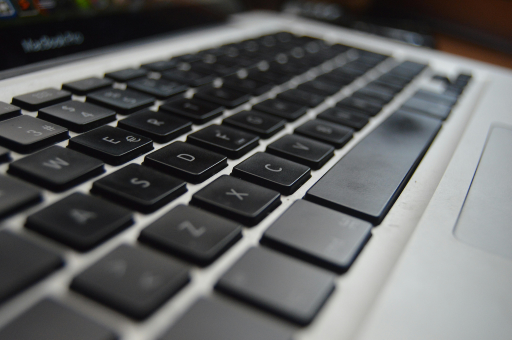Close-up macro view of black keys on a laptop keyboard.