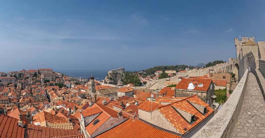 Panoramic view of Dubrovnik’s old town with red rooftops and stone walls by the sea