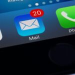 Smartphone screen showing Google, Mail with 20 unread emails, and Phone app icons.
