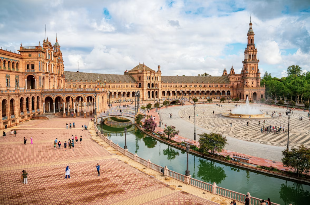 Panoramic view of Plaza de España in Seville with its canal, fountain and ornate historic buildings