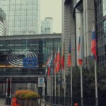 European Parliament building in Brussels with EU and member state flags outside